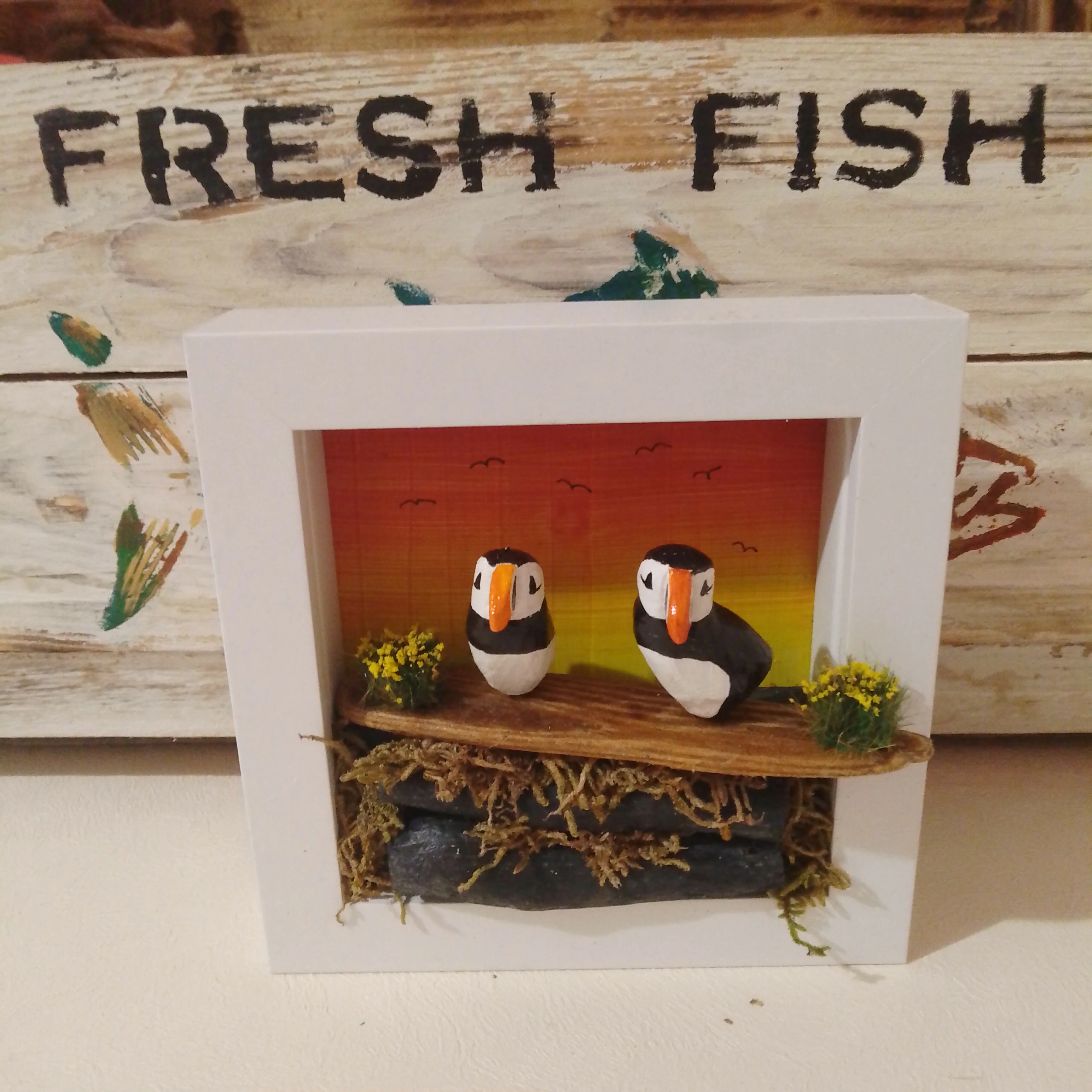 2 Puffins On Frame, Orange Background