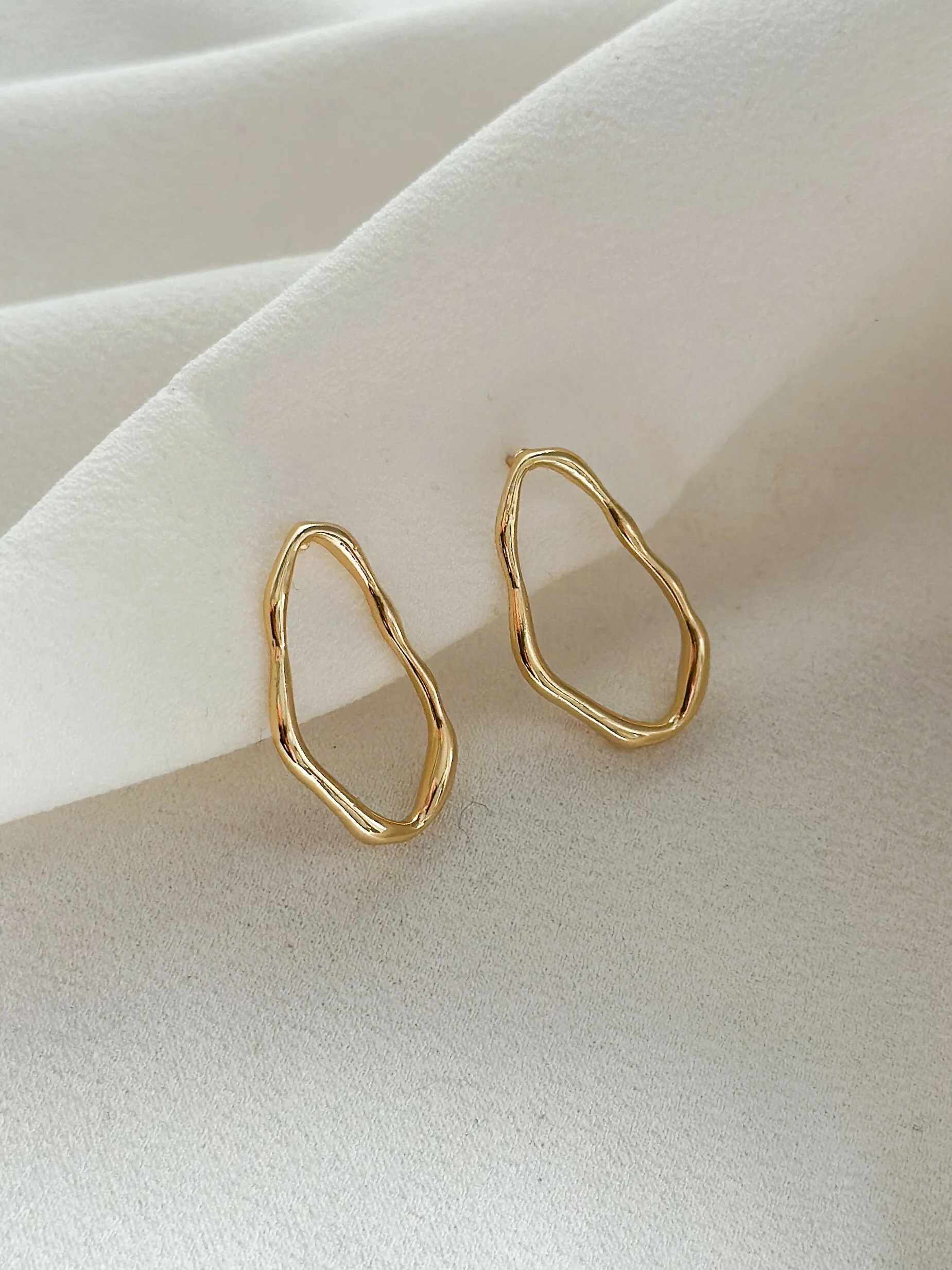 Asymmetric stud earrings