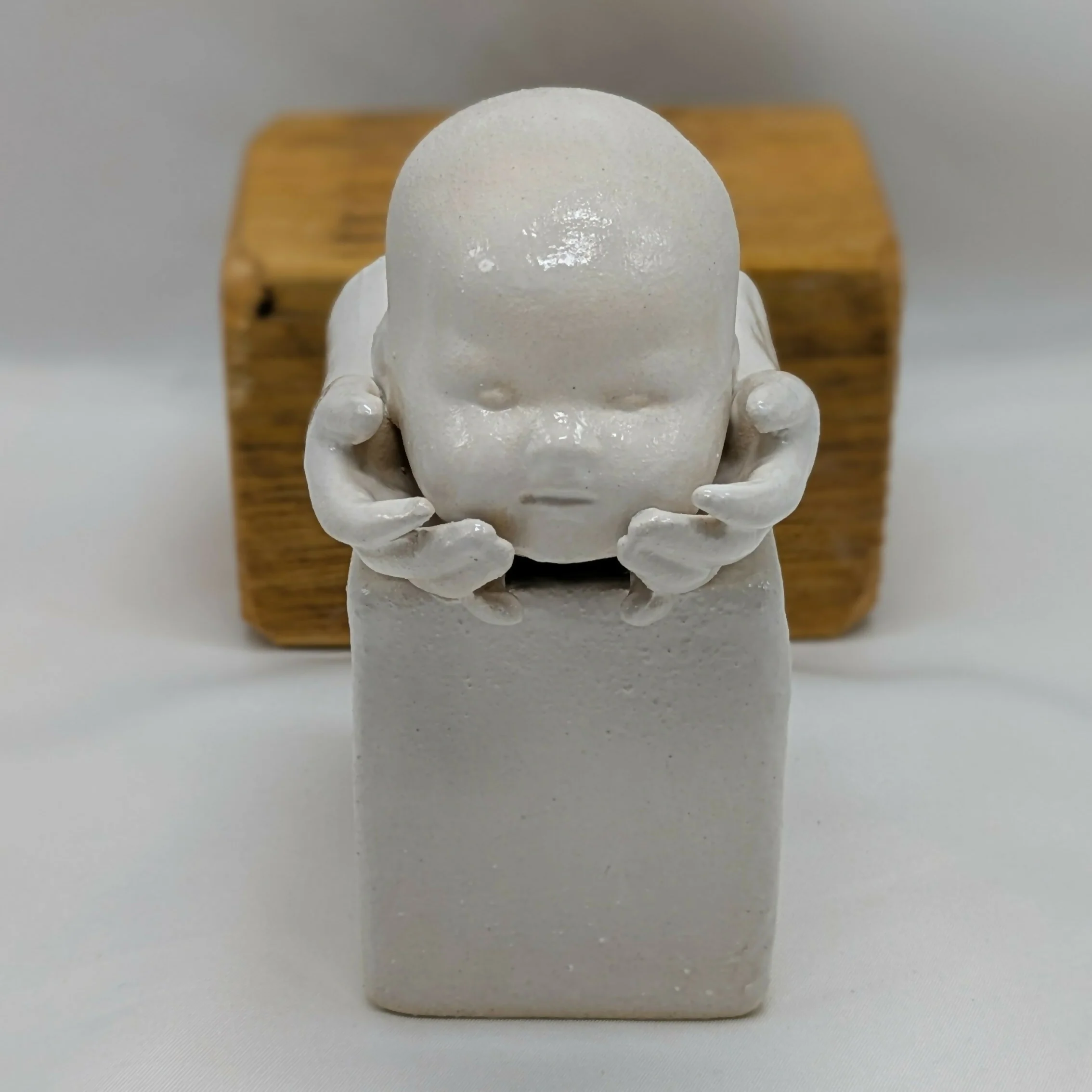 Balance Dolls Head in Hands Ceramic Sculpture