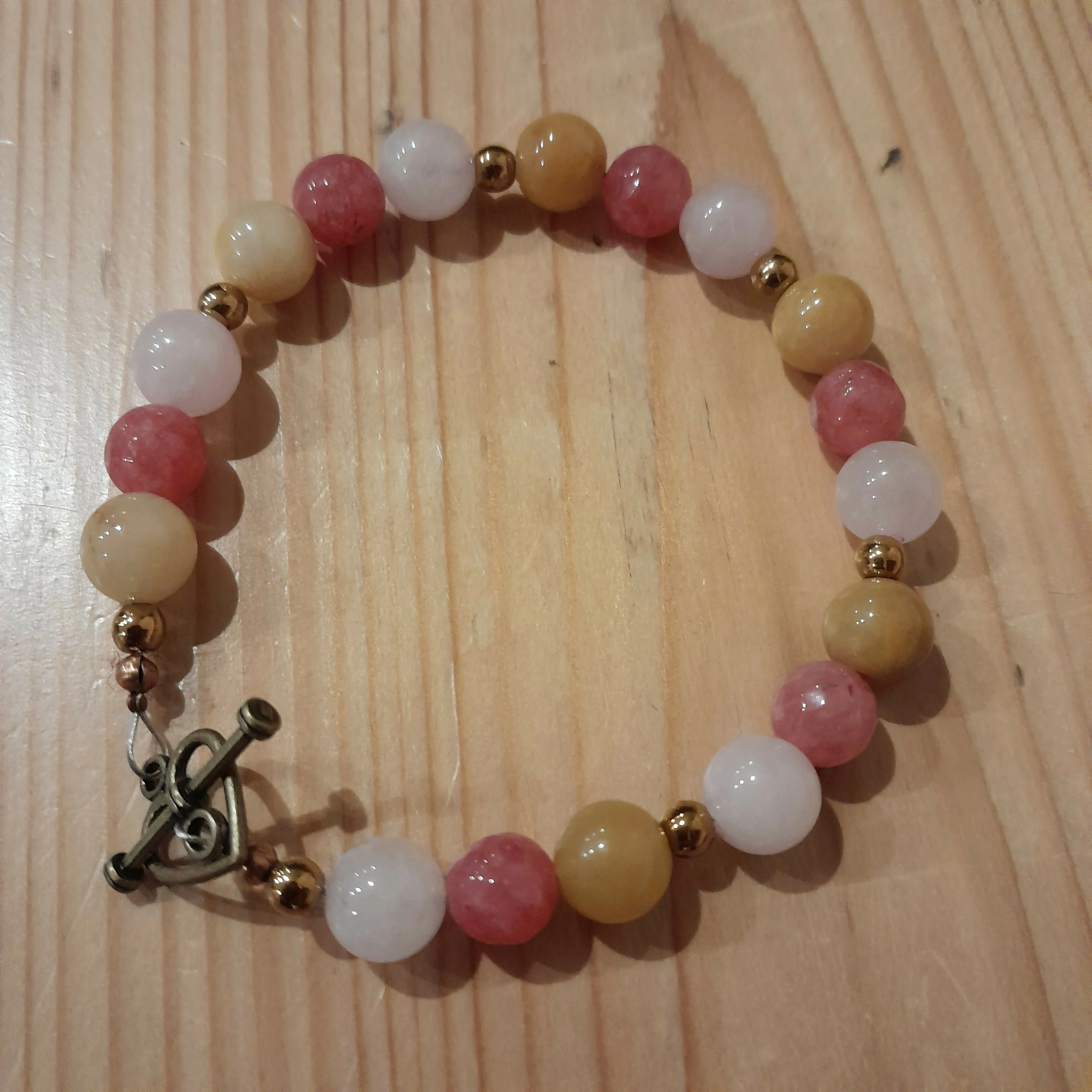 Bronze toggle Catch Bracelet with Yellow Jade, Strawberry Quartz, Rose Quartz and Bronze Hematite.