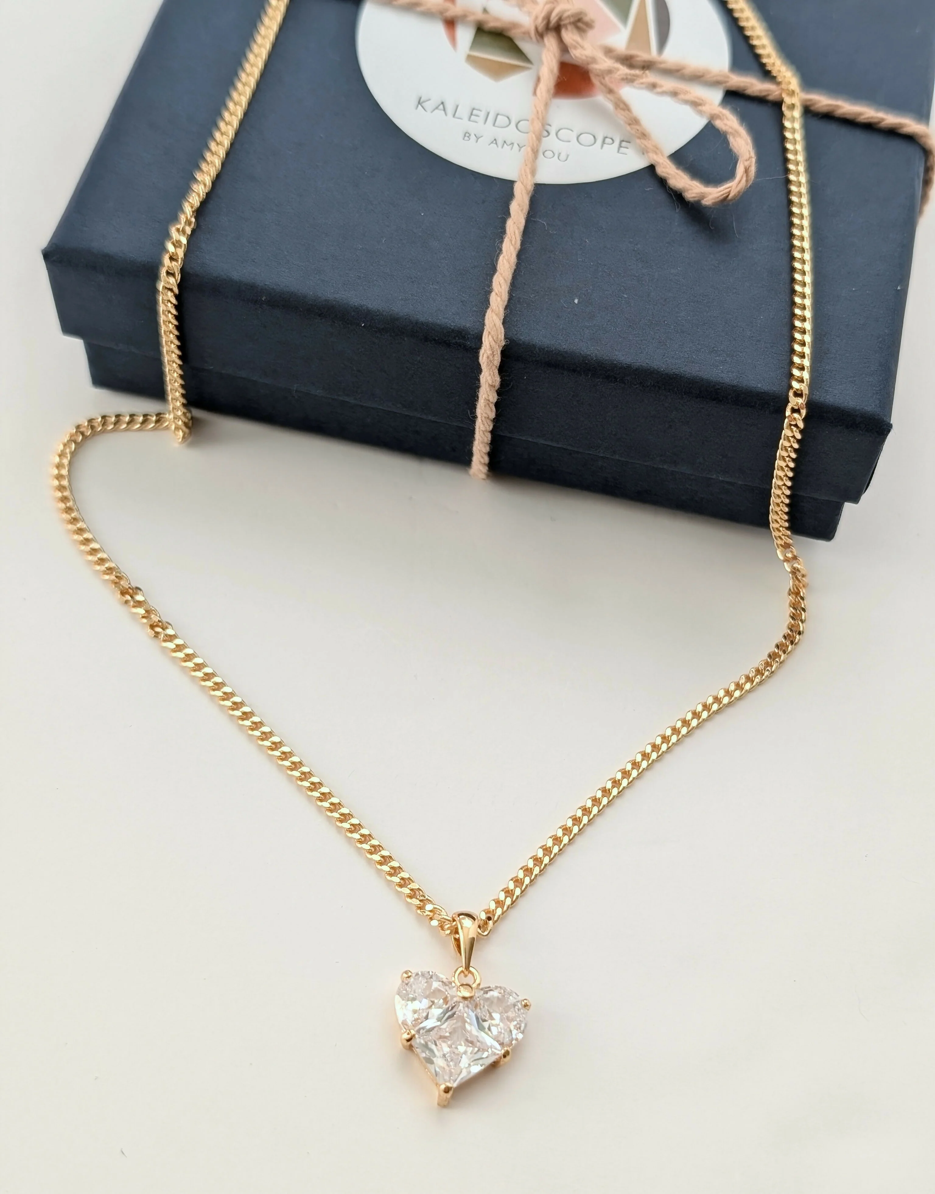 Clear Cubic Zirconia Heart Charm Necklace on a Gold Plated Chain - Image 2