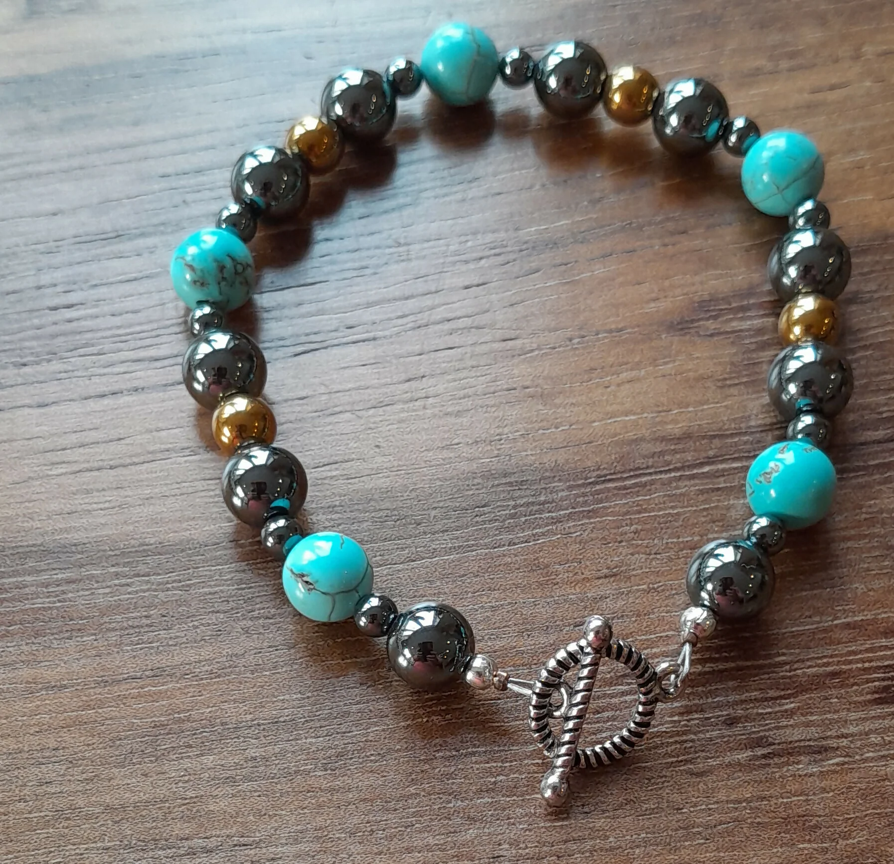 Gemstone Bracelet with a Tibetan Silver Toggle Catch, Grey Hematite, Turquoise and Bronze Hematite.