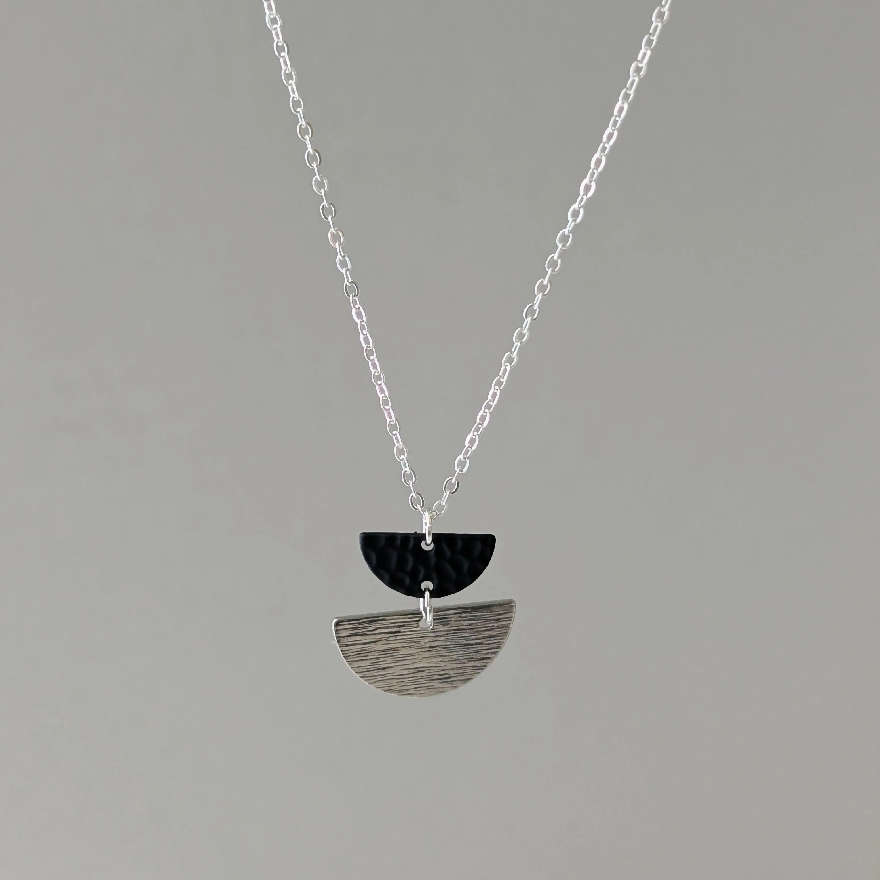 Geometric Necklace with Matte Black Charm and Silver Half Moon on Fine Silver Plated Chain - Image 2