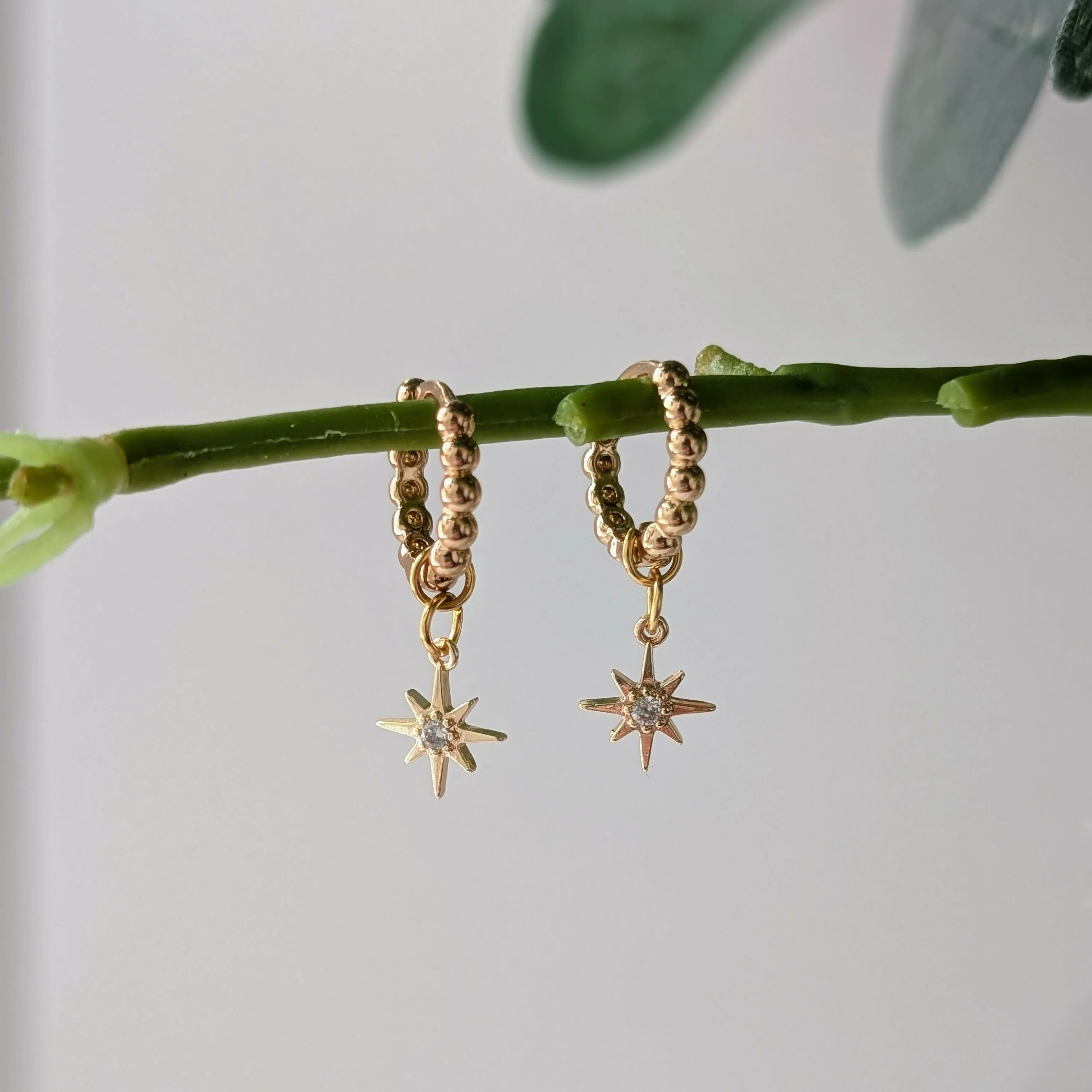 Gold Plated Bead Huggie Earrings with a Tiny Gold Cubic Zirconia Star Charm