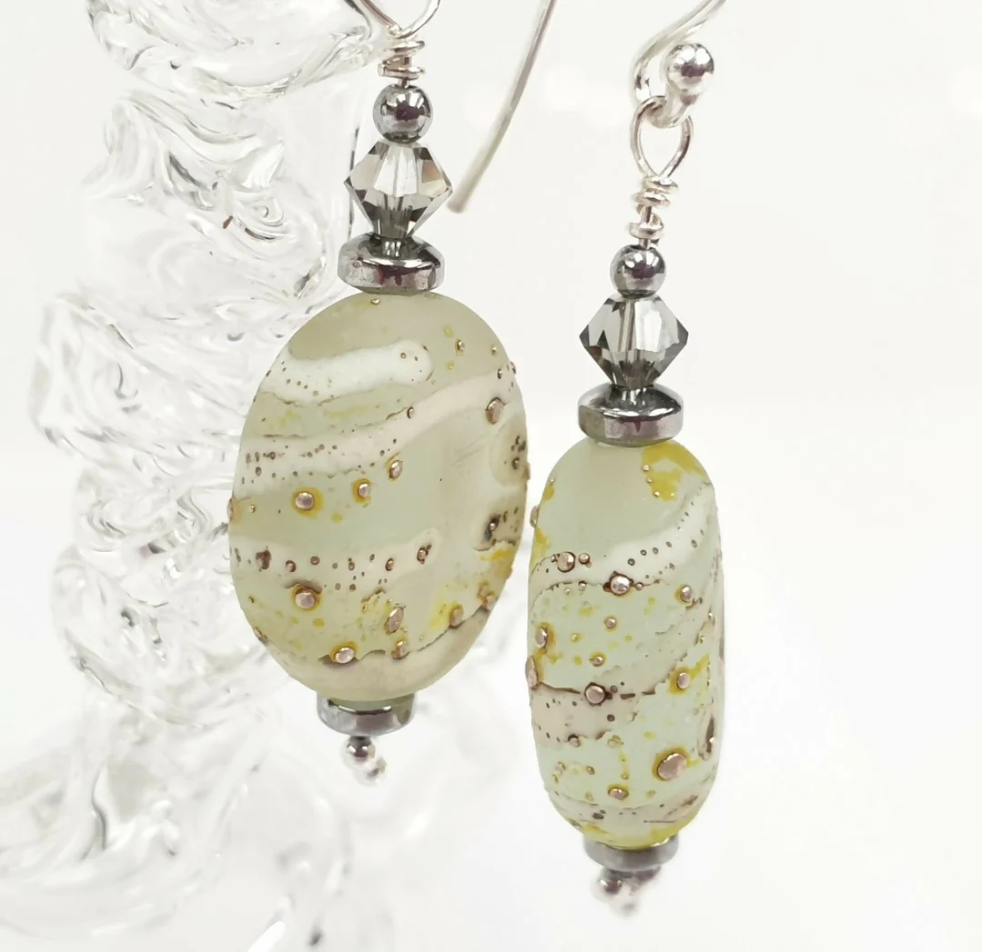 HAND LAMPWORKED ETCHED DROP GLASS EARRINGS, WITH STERLING SILVER EAR WIRES AND SWAROVSKI CRYSTALS.