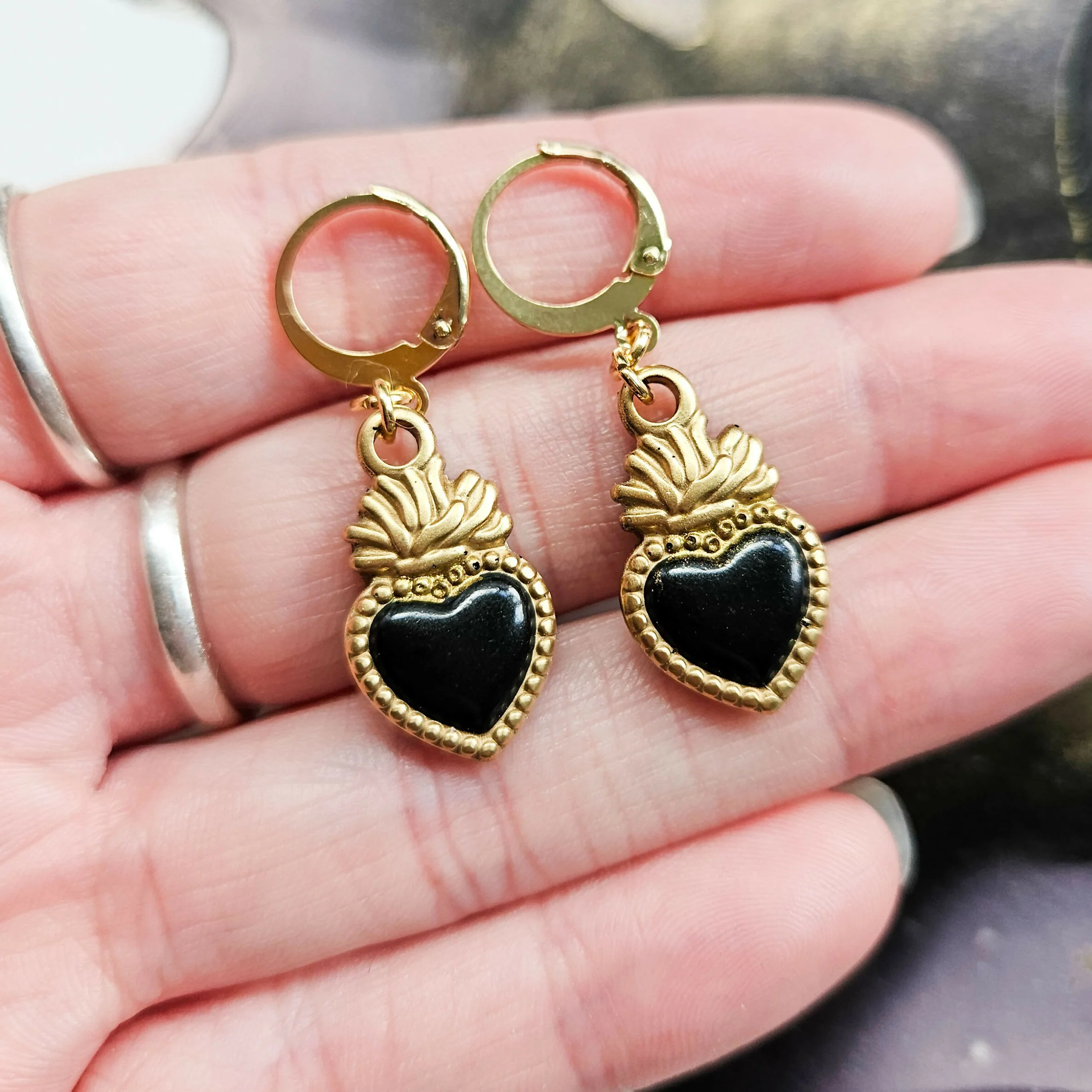 Handmade Black And Gold Sacred Hearts Resin Charms On Huggie Hoops - Image 2