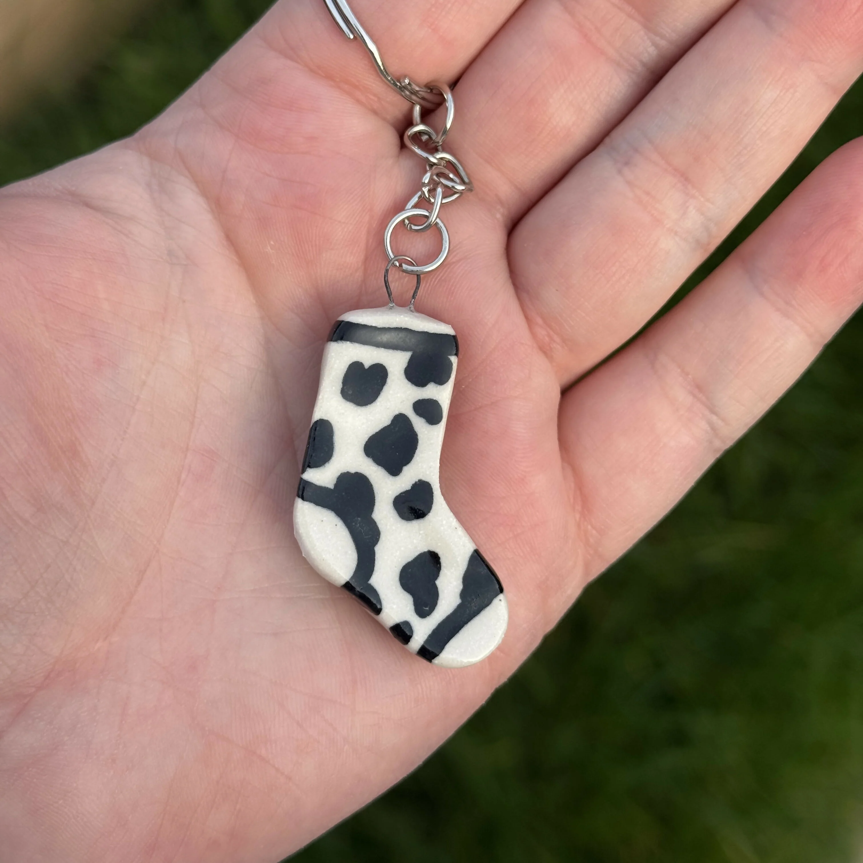 Handmade Ceramic Keyring, Cow Print Sock - Image 3