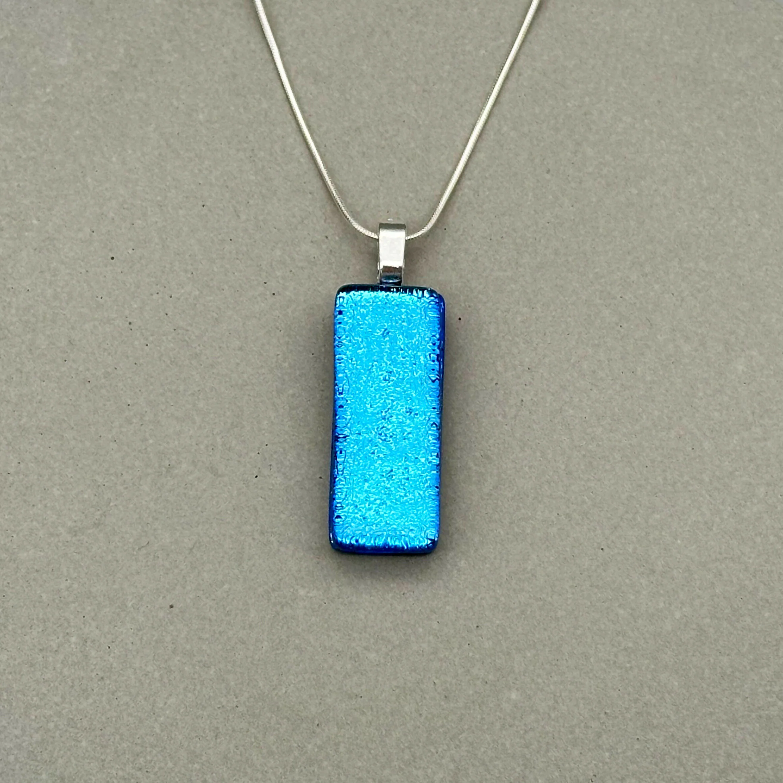 Light Blue Dichroic Fused Glass Pendant with Silver Plated Chain - Handmade by Jade Tapson Glass.