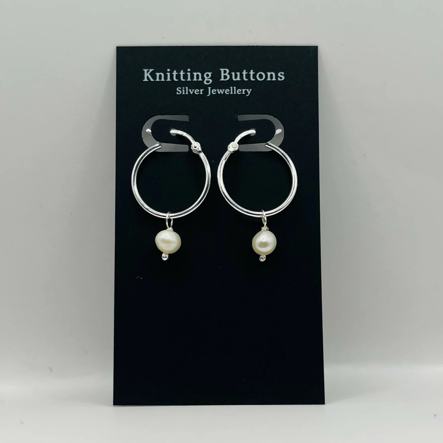Pearl Huggie Earrings - Image 7