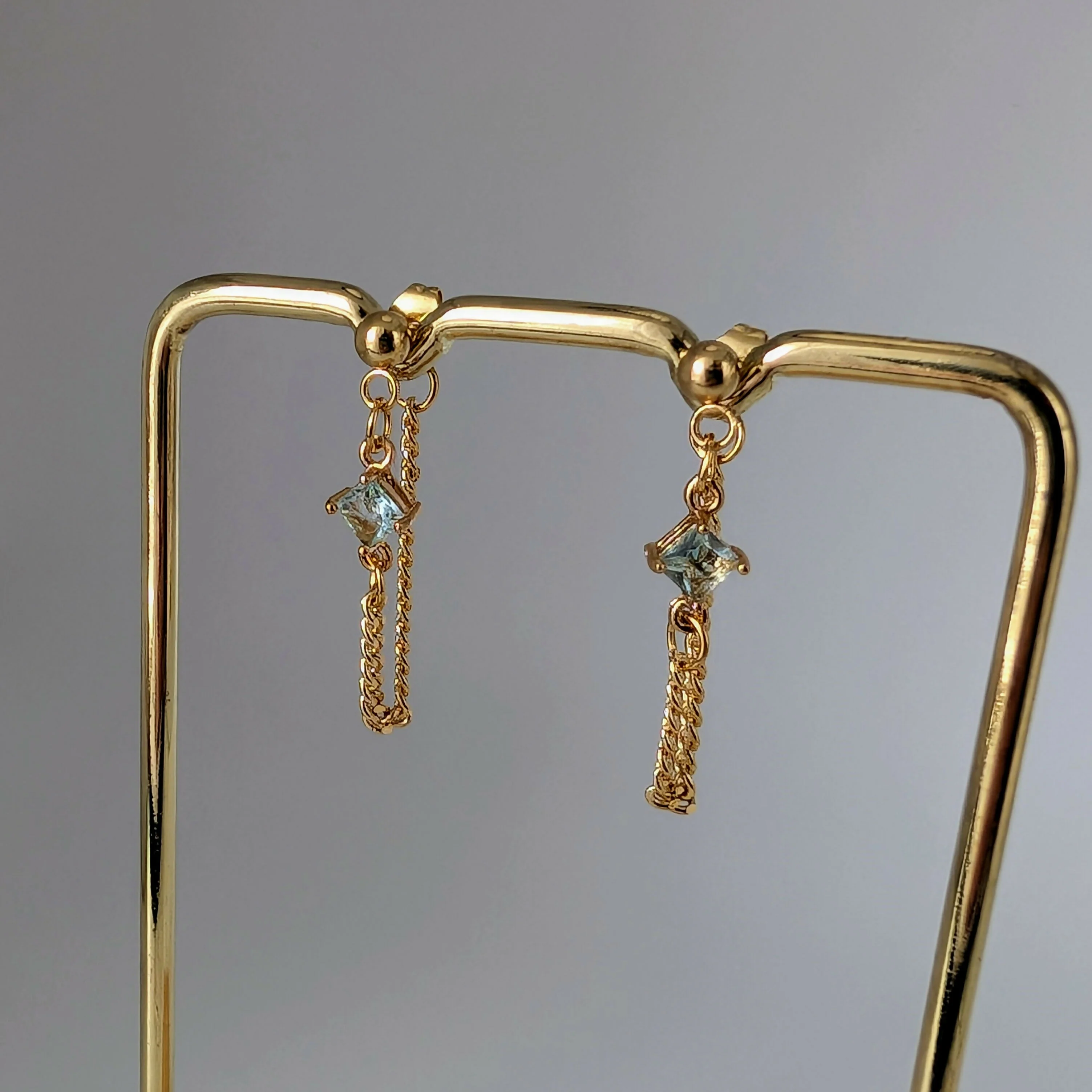 Powder Blue Zirconia Chain Earrrings on Gold Plated Ball Stud - Image 2