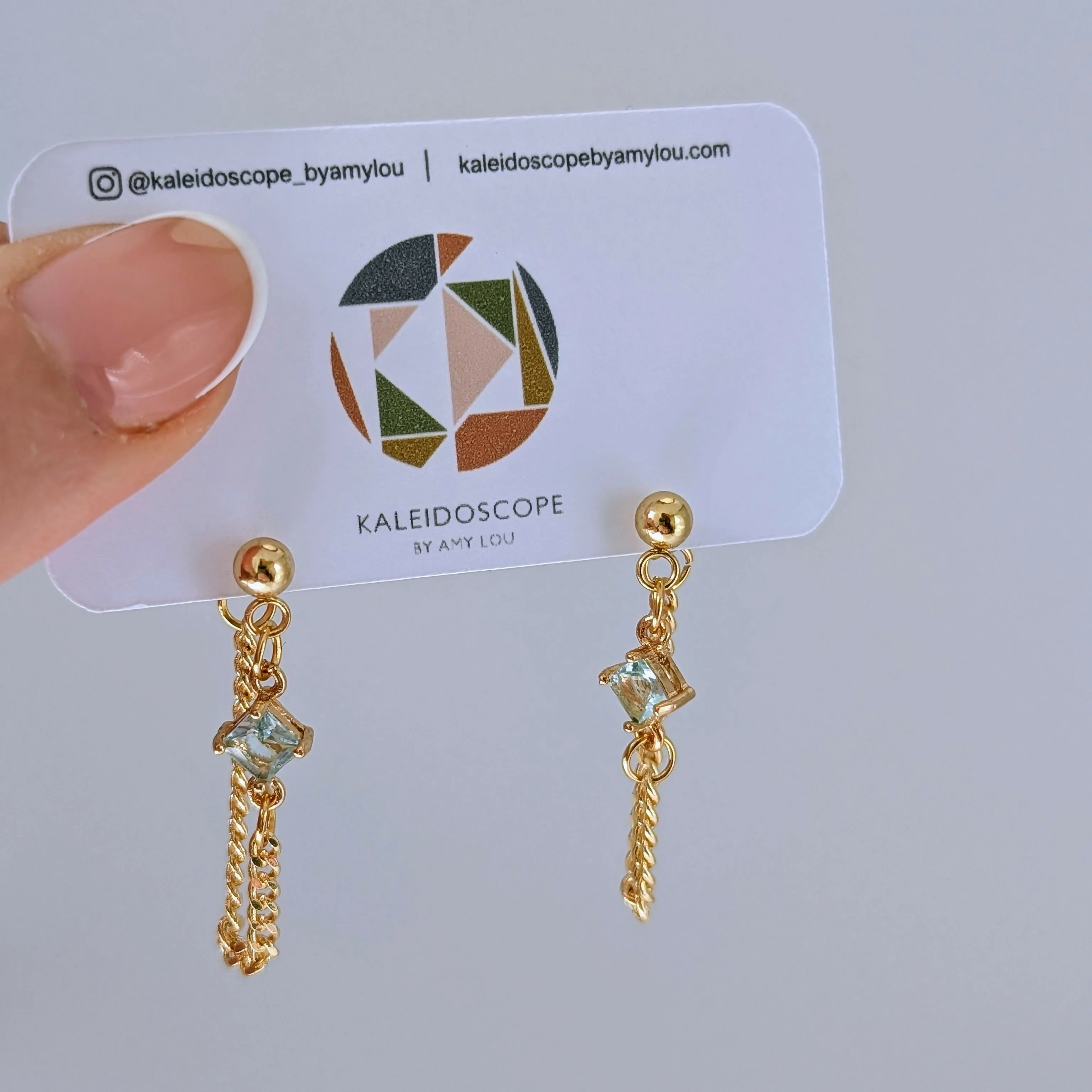 Powder Blue Zirconia Chain Earrrings on Gold Plated Ball Stud - Image 3
