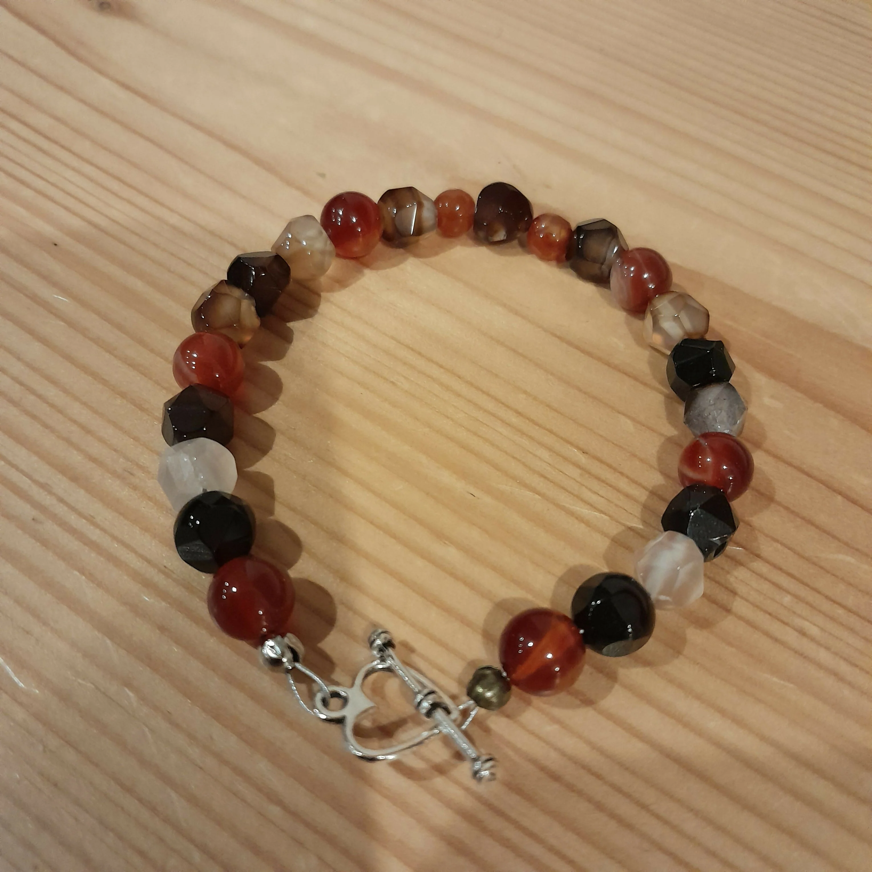 Tibetan Silver Toggle Catch Bracelet with Carnelian and Faceted Moha Banded Agate .