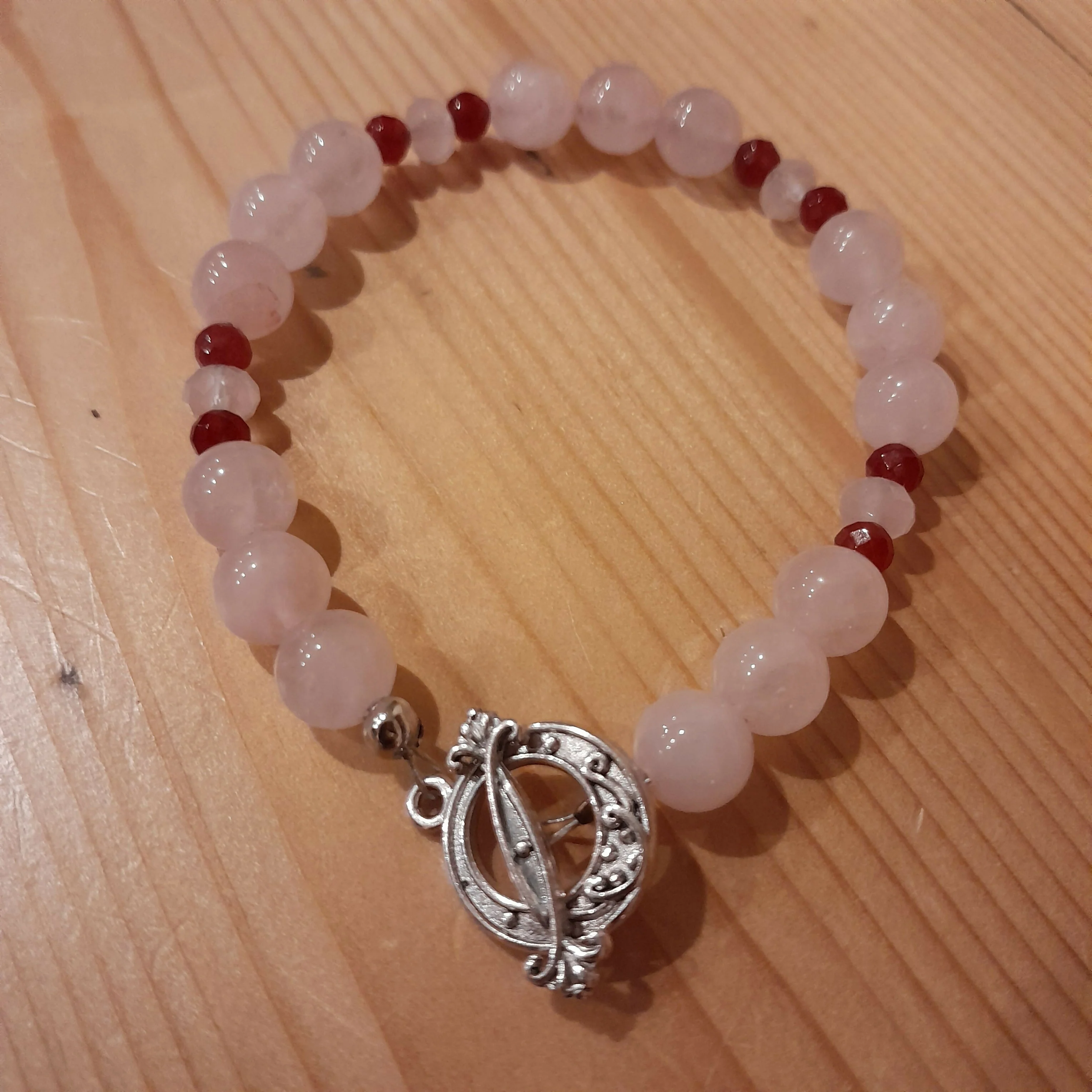 Tibetan silver toggle Catch bracelet with Rose Quartz, Faceted red chalcedony and Faceted Rose Quartz.