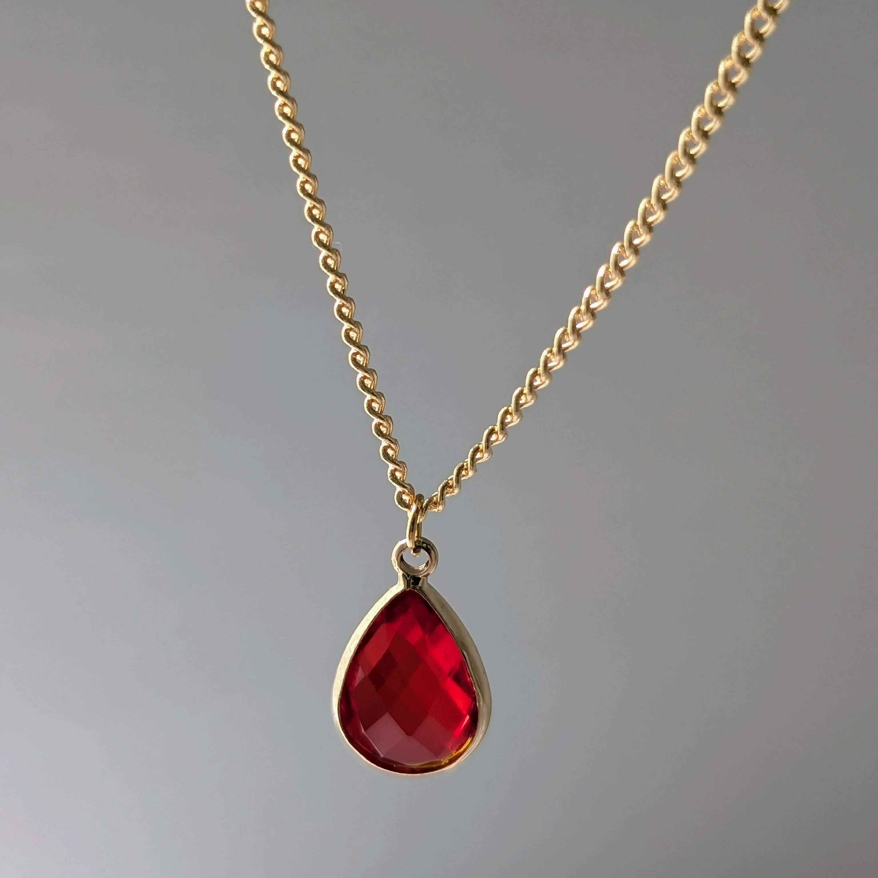 Vibrant Red Faceted Crystal Teardop Charm Necklace on a Gold Plated Chain - Image 2