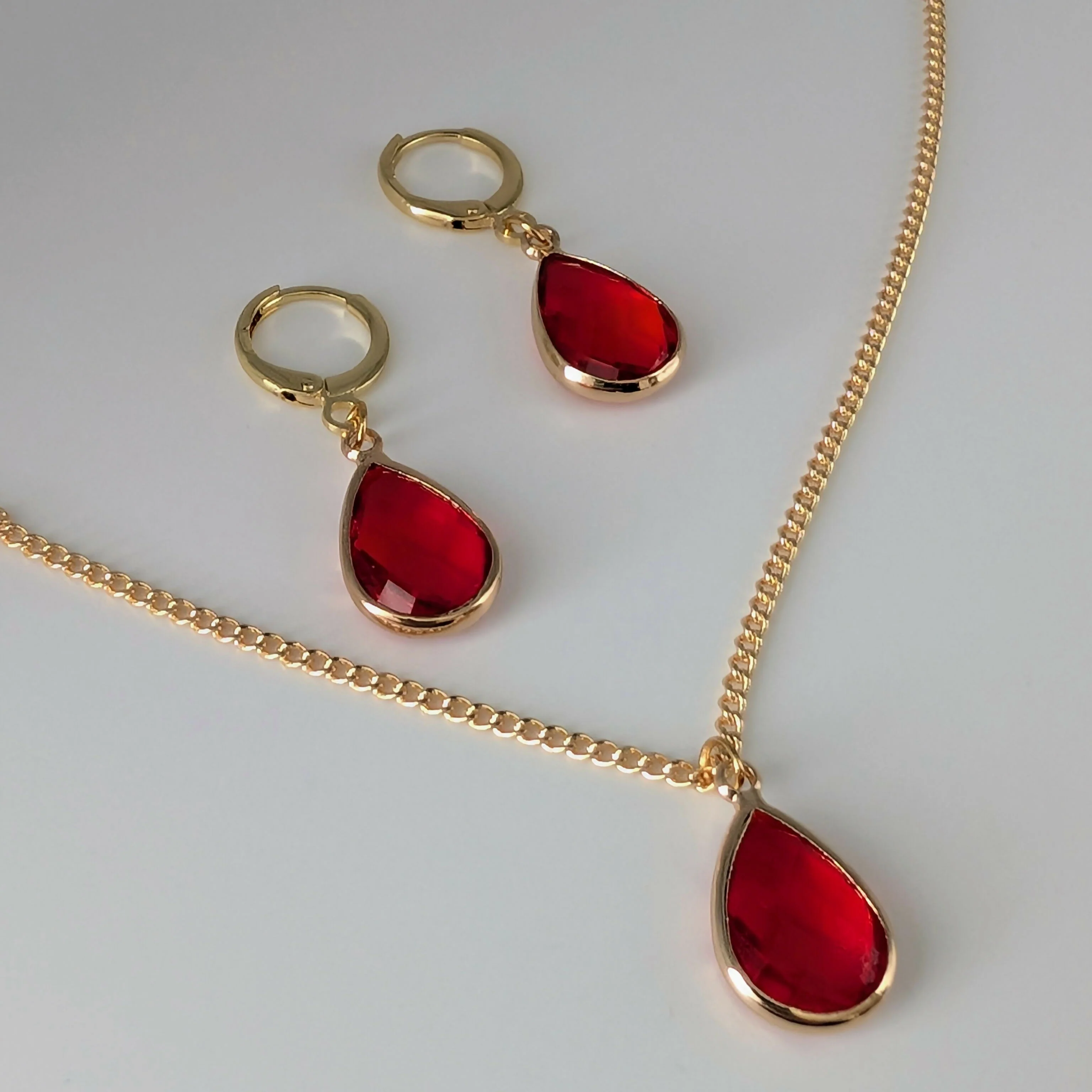 Vibrant Red Faceted Crystal Teardop Charm Necklace on a Gold Plated Chain - Image 3