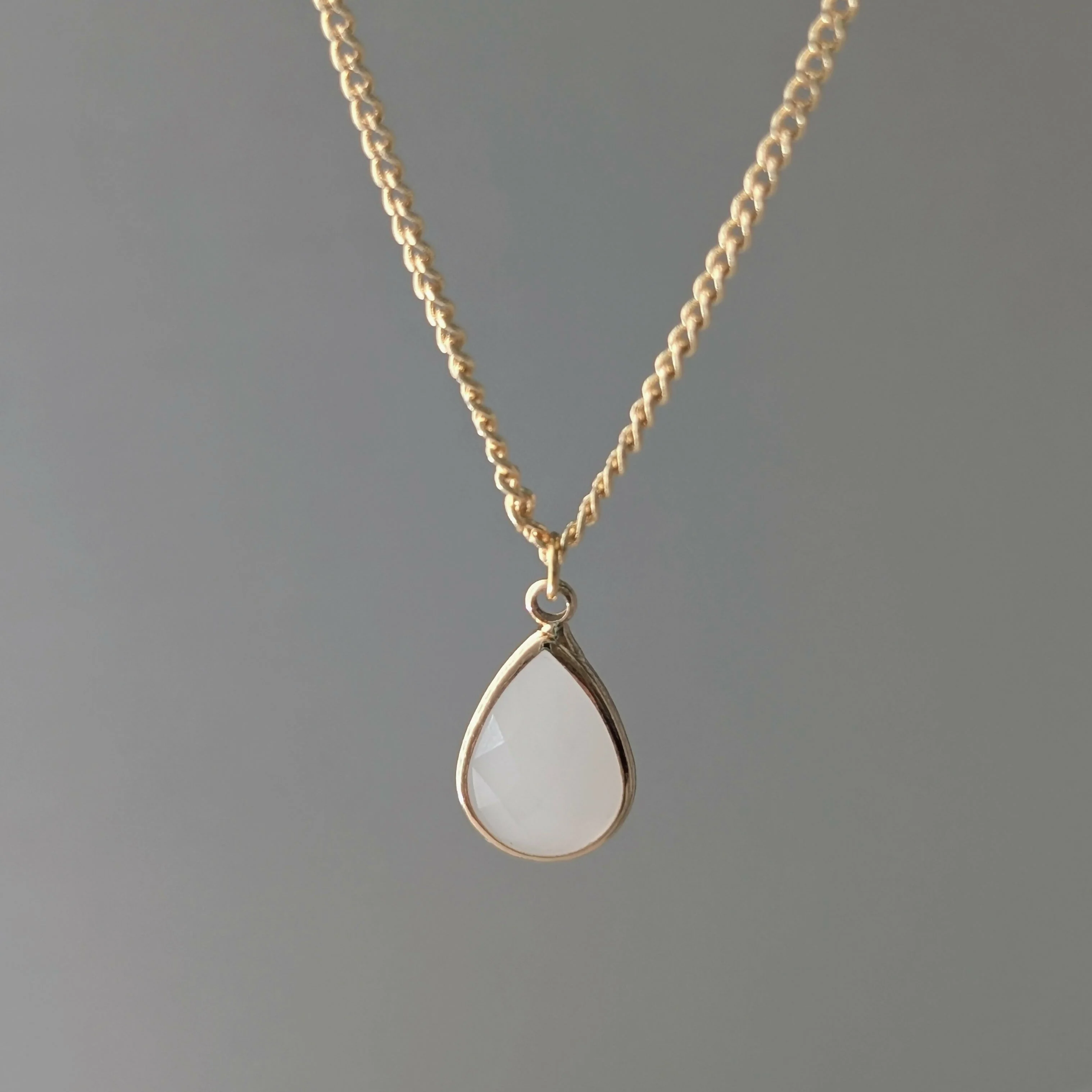 White Jade Faceted Teardop Charm Necklace on a Gold Plated Chain - Image 2